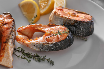 Grilled salmon steaks on plate, close up
