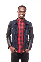 Portrait of a happy casual afro American man standing with hands in pocket in studio on white isolated background