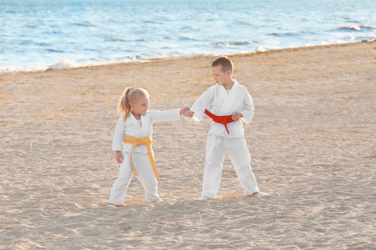 Little children practicing karate outdoors