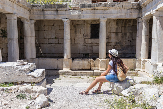 Woman traveller exploring ancient ruins