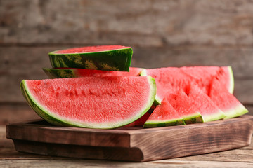 Tasty sliced watermelon on wooden table