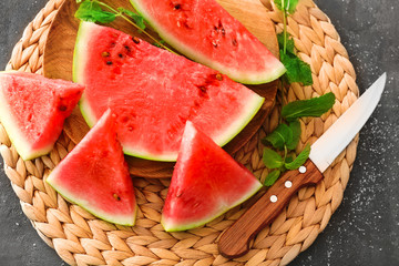 Slices of tasty watermelon on table