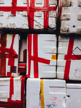 Red Tape on White Styrofoam Boxes