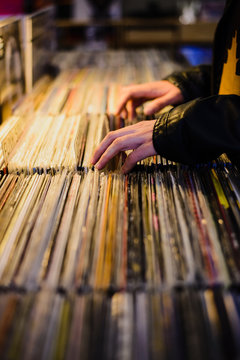 Hands diggin for vinyls in an antique record store