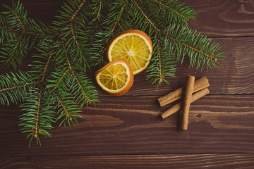 Fototapeta na wymiar Christmas tree with dried oranges and cinnamon