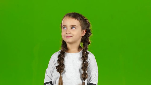 Child waves his hand. Green screen
