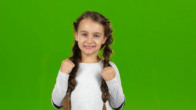 Baby rejoices in victory. Green screen