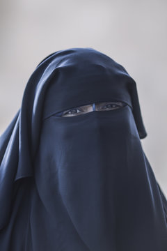 portrait of a mature traditional Muslim woman in North Africa, religious believer in the Medina