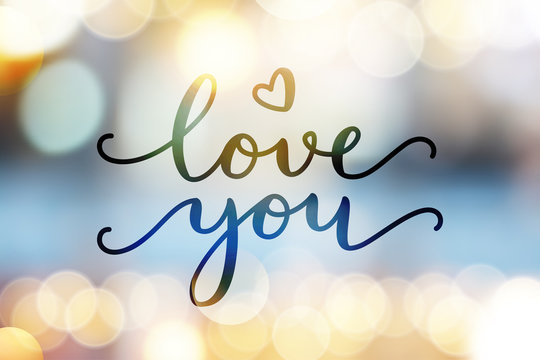 love you, vector lettering on blurred lights background, valentine card template