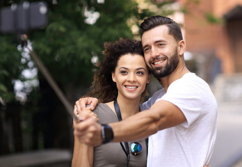 Happy traveling couple making selfie, romantic mood.