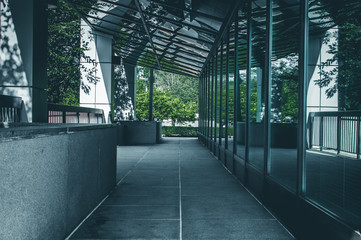 Modern office building exterior in black and white. Window reflections of glass building interior. Modern art architecture design. Urban geometry. Minimal architecture design.