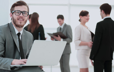 communication concept:businessman with a stylish laptop on the k