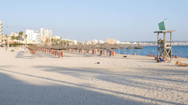 Can Pastilla Mallorca Spain: People on nearly empty beach in the evening