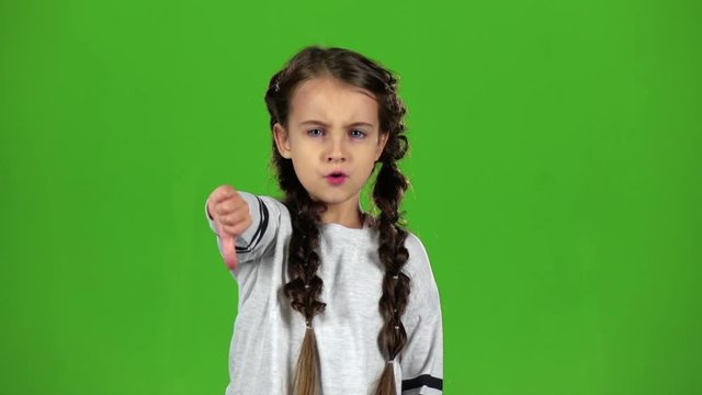 Baby is showing the finger down. Green screen. Slow motion
