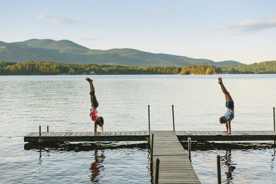 Children on Playing on Dock at Sunset