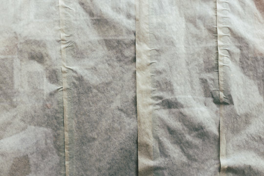 Layered strips of paper in widow