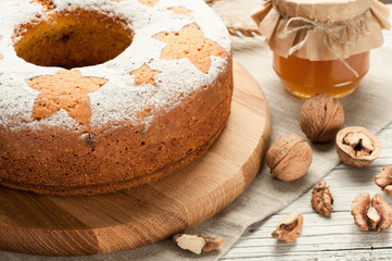 homemade traditional fruit cake at white wooden table