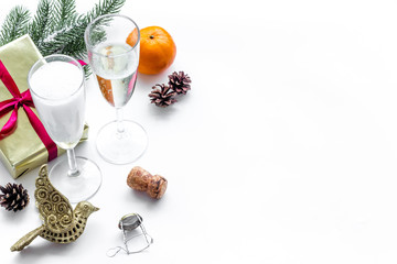 Party with present box, spruce, champagne and glasses to celebrate New Year 2018 on white background mock-up