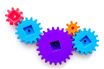 Moving forward concept with gears. Right decision and correct solution. white desk background top...