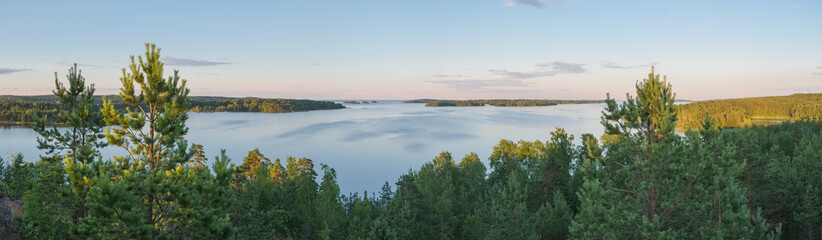 Summer evening panorama landscape from the high shore of Ladoga lake in the skerries to the bay of Lehmalahti and the islands