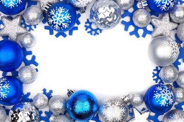 Christmas frame of blue and silver ornaments isolated on a white background