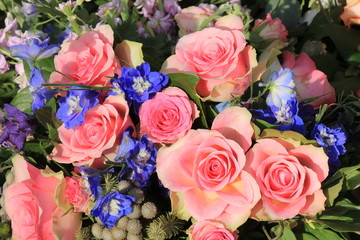 Pink roses and blue larkspur