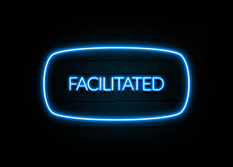 Facilitated  - colorful Neon Sign on brickwall