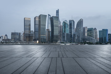 night view of empty brick floor with shanghai cityscape and skyline