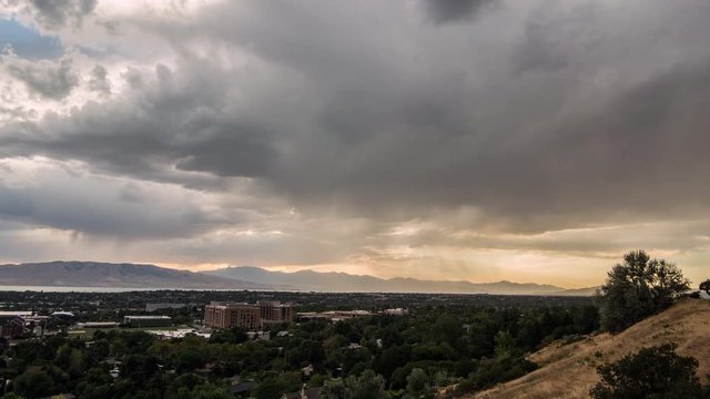 Time lapse of stormy clouds at sunset moving over Provo Utah