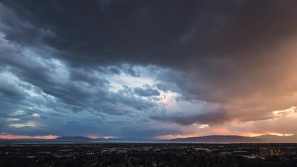 Time lapse of colorful sky at sunset over looking Provo Utah looking towards Utah Lake.