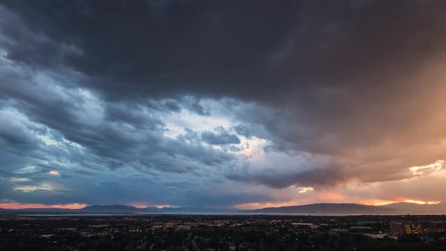 Time lapse of colorful sky at sunset over looking Provo Utah looking towards Utah Lake.