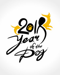 Year of the Dog. 2018. Handwritten template with the inscription and silhouette of a yellow dog. Imitation of painting with brush and ink. Symbol of the year on the Chinese calendar. 
