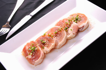 slices of spiced raw pork