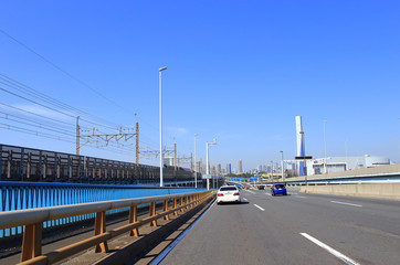 Fototapeta na wymiar Car driving on highway, Tokyo bay area