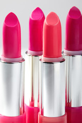 Beautiful set of lipsticks in red colors. Beauty cosmetic collection. Fashion trends in cosmetics with bright lips