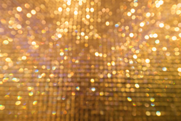 Abstract gold colour bokeh for background.