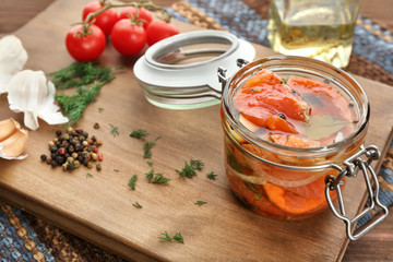 Fototapeta na wymiar Jar with delicious marinated salmon on table