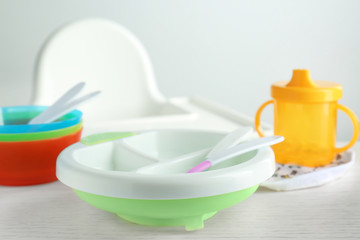Bright baby dishware on table