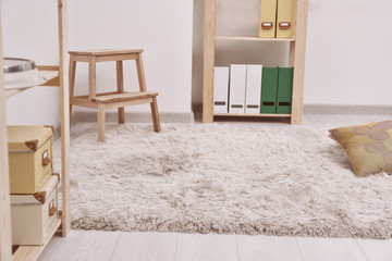 Fototapeta na wymiar White soft carpet on floor indoors