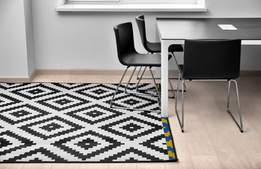 Black and white carpet on floor indoors