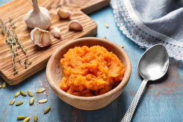 Bowl with mashed sweet potato on table