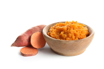 Bowl with mashed sweet potato on white background