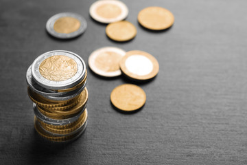 Stack of coins on dark background