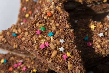Cakes with a colorful sprinkling of stars on a white plate