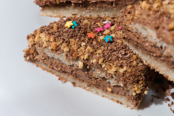 Cakes with a colorful sprinkling of stars on a white plate