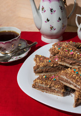 Cakes with a colorful sprinkling of stars on a white plate