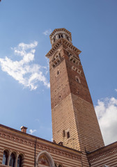 Fototapeta premium Lamberti tower in Verona Italy. Shooted in a september noon with blue sky and white cloud