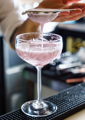 barman making cocktail in the bar