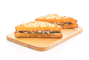 baked spinach and ham sandwich with sauce
