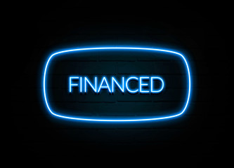Financed  - colorful Neon Sign on brickwall